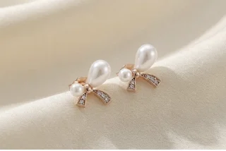 گوشواره پاپیونی مروارید مارک معتبر ژوپینگ ضد حساسیت و رنگ ثابت مناسب استفاده روزانه